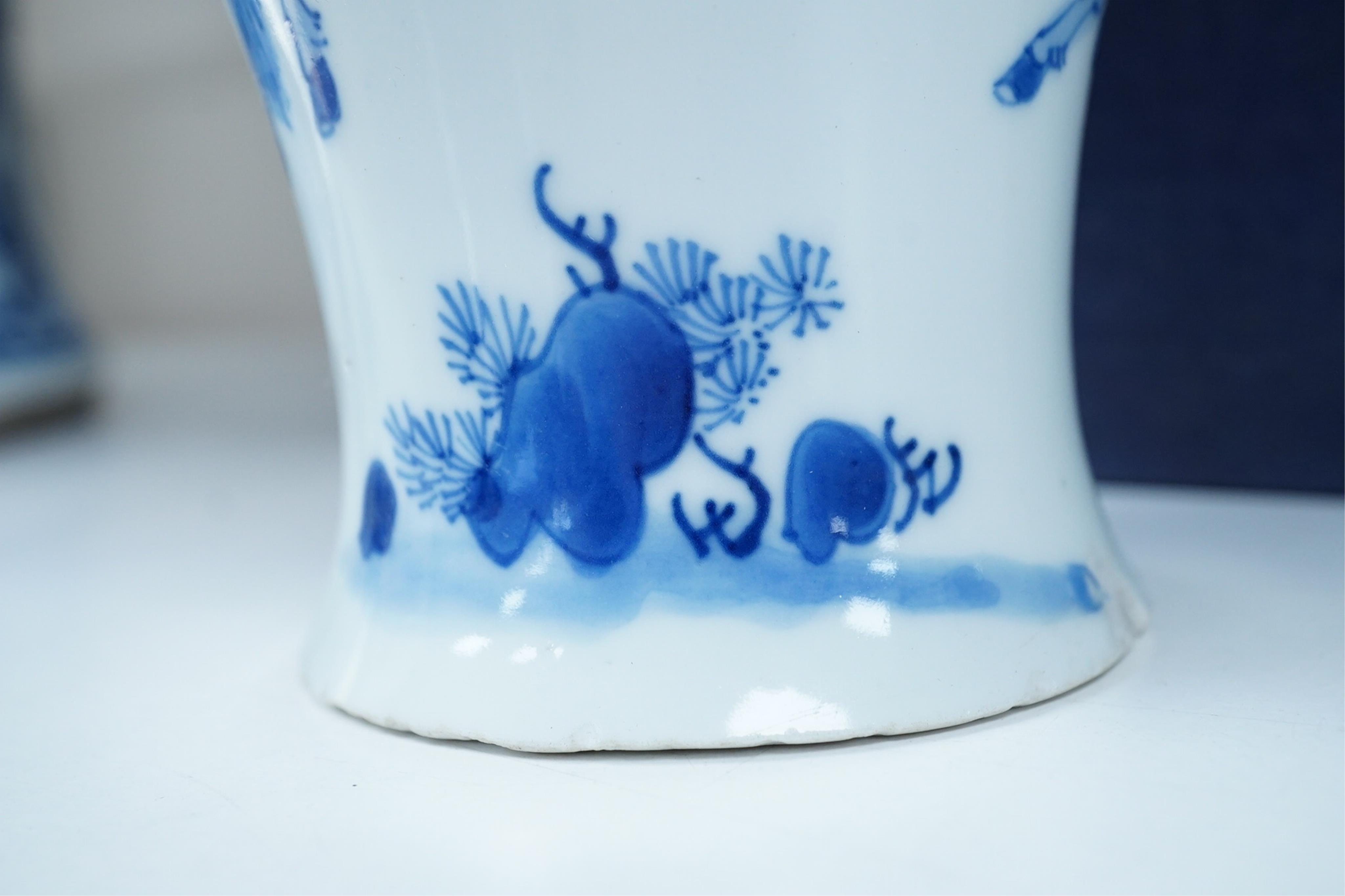A Chinese blue and white baluster vase, early Kangxi, and associated cover
